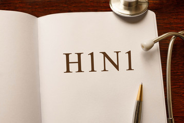Page with H1N1 on the table with stethoscope, medical concept