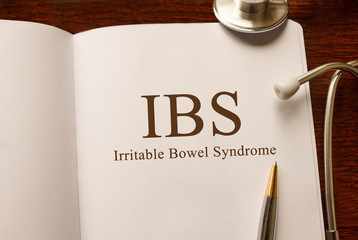 Page with IBS (Irritable Bowel Syndrome) on the table with stethoscope, medical concept