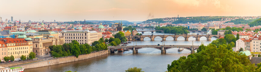Panorama of the old part of Prague from the Letna park. Beautiful view on the bridges over the river Vltava at sunset. Old Town architecture, Czech Republic.
