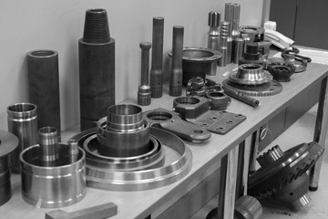 Industrial lathe tool and high precision cnc turning parts. high precision automotive machining mold and die part. CNC prosessed parts on table.