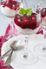 Dessert  with fresh berries, cottage cheese, chocolate cookies and forest berries jam