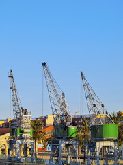 Fototapeta na wymiar Spain, Catalonia, Tarragona, View of the port cranes.
