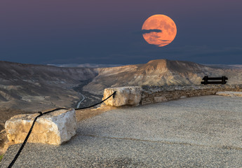Rising of supermoon above mountains in desert of the the Negev, Israel, November 14, 2016 - obrazy, fototapety, plakaty