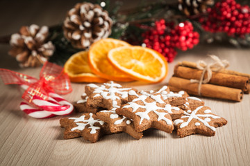 Fototapeta na wymiar Christmas cookies on a wooden surface with the background decor