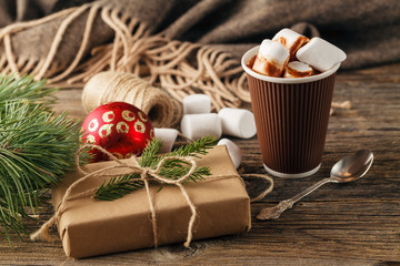 Fototapeta na wymiar Hot drink with marshmallows on the background of Christmas decor