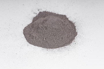 slide from black volcanic clay powder for cosmetic procedures