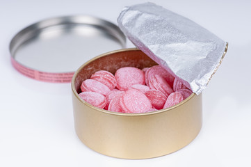 caramel sweets in tin box isolated on white