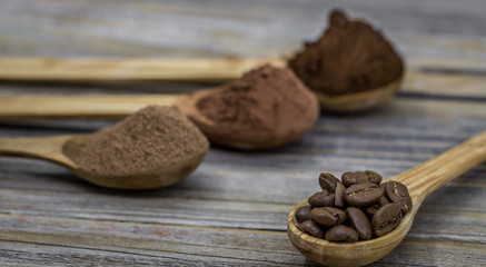 beautiful little wooden spoon with coffee on  background
