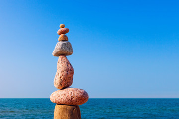 Fototapeta na wymiar Balance and poise stones. Rock zen on the background of blue sky
