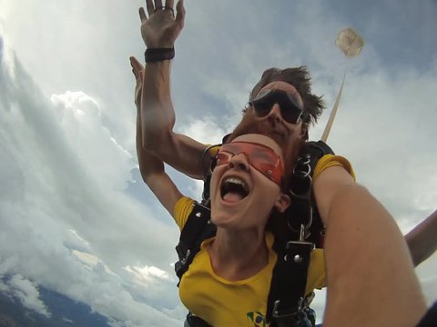Skydiving couple jump from the plane