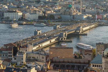 Naklejka premium View of the famous Galata Bridge and the historical center of Istanbul at sunset, Turkey 