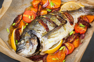 Oven baked whole sea bream fish  with vegetables