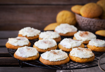 Homemade pumpkin spice cake cookies with glaze and cinnamon