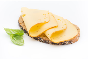 Cheese slices on bread. White background.