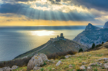Sunset over Black Sea. The ruins of Genoese fortress (Cembalo) i