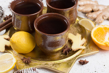 Christmas winter tea with ginger, anise, sugar, cinnamon, orange