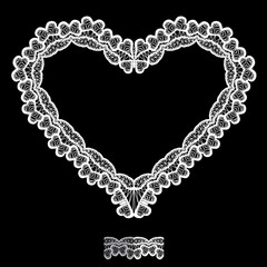 Obraz premium White Heart shape is made of lace doily isolated on black backgr