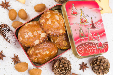 Christmas cookies with almond nuts and ginger in tin box