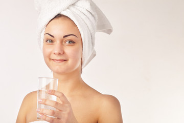Spa woman. Beautiful girl with glass of water