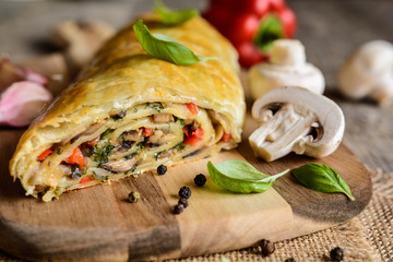 Vegetable savory strudel stuffed with mushrooms, red pepper, onion, garlic and parsley