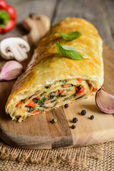 Vegetable savory strudel stuffed with mushrooms, red pepper, onion, garlic and parsley