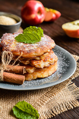 Sweet pancakes made of apple, curd and cinnamon