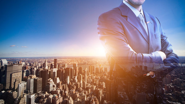 Double exposure of a businessman in front of a big city