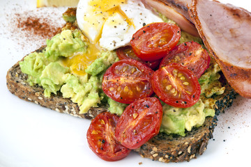 Avocado Toast with Cherry Tomatoes Poached Egg and Bacon Top Vie