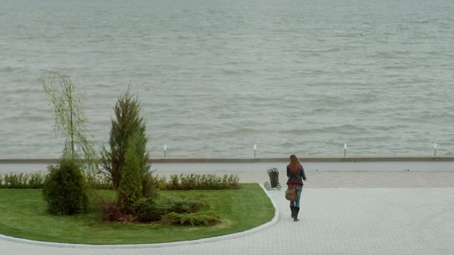 Woman going near lake