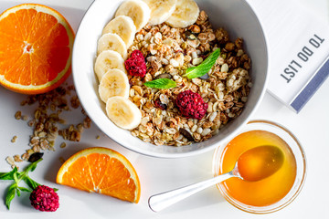 Breakfast with oatmeal and to do list on white background
