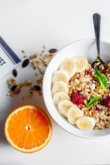 Breakfast with oatmeal and orange juice on white background