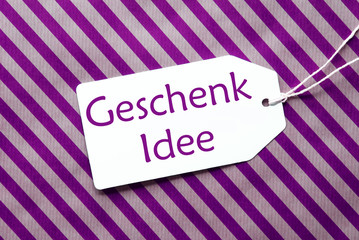Label On Purple Wrapping Paper, Geschenk Idee Means Gift Idea