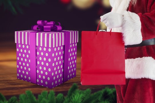 Santa Claus Holding Shopping Bag