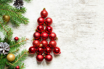 christmas tree from red balls and fir tree branches with decorations