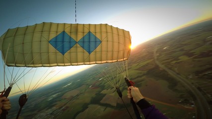 Paragliding at the sunset pov, blurred background