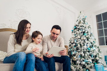 Family playing video game on tablet pc