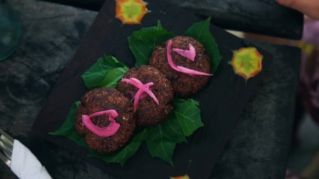 Fresh Vegetable Kibbeh served on wooden board