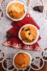 Fototapeta na wymiar homemade muffins in christmas background