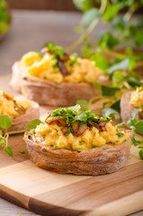 Scrambled eggs on toast with herbs