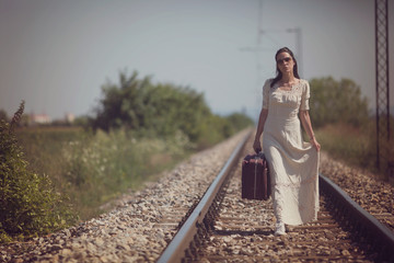 Fototapeta premium Woman on a railway retro style
