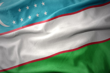 waving colorful flag of uzbekistan.