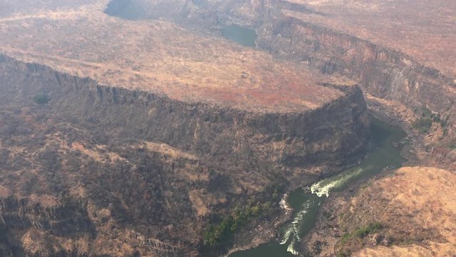 Aerial view of Victoria Falls and the Zambezi River (4K UHD footage) made from a helicopter