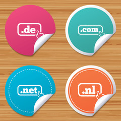 Round stickers or website banners. Top-level internet domain icons. De, Com, Net and Nl symbols with hand pointer. Unique national DNS names. Circle badges with bended corner. Vector