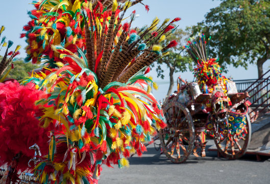 Ornamental and colorful feather on a sicilian cart during a folk festival