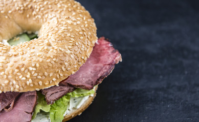 Bagel (with Roast Beef) on vintage background
