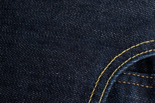 Denim jeans and pocket with dark blue shade. Detail of denim jea