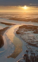 Winter river landscape and sunset, top view