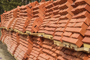Obraz na płótnie Canvas Red bricks lying at a construction site .