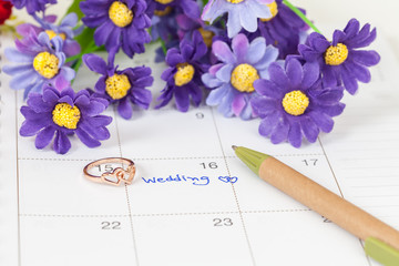 Wedding note on a calendar sets a reminder for the wedding