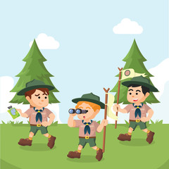 Obraz na płótnie Canvas group of boyscout walking in forest